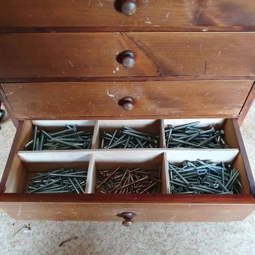 129 - A collector's type chest, of six drawers, with contents of screws, 38.5 cm wide, and four other offi... 