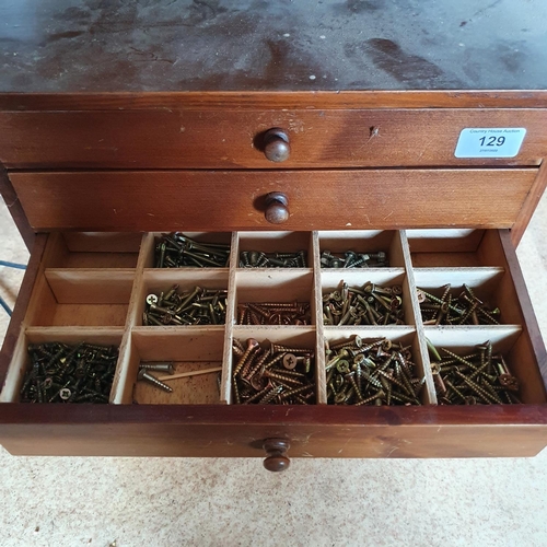 129 - A collector's type chest, of six drawers, with contents of screws, 38.5 cm wide, and four other offi... 