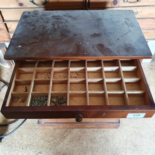 129 - A collector's type chest, of six drawers, with contents of screws, 38.5 cm wide, and four other offi... 