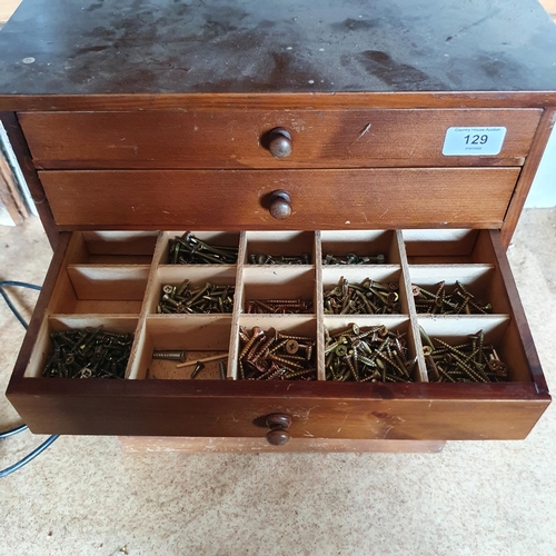 129 - A collector's type chest, of six drawers, with contents of screws, 38.5 cm wide, and four other offi... 