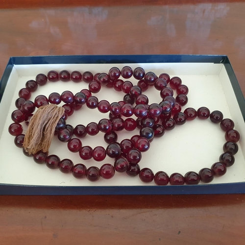 470 - A set of cherry amber type worry beads