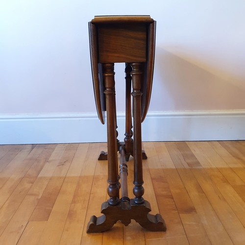 489 - A Victorian burr walnut Sutherland table, on turned supports, 74 cm wide