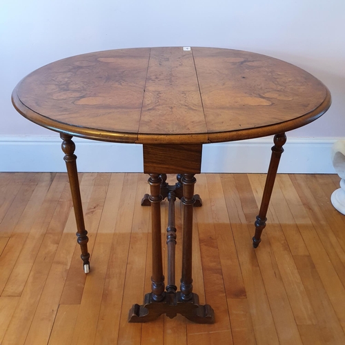 489 - A Victorian burr walnut Sutherland table, on turned supports, 74 cm wide