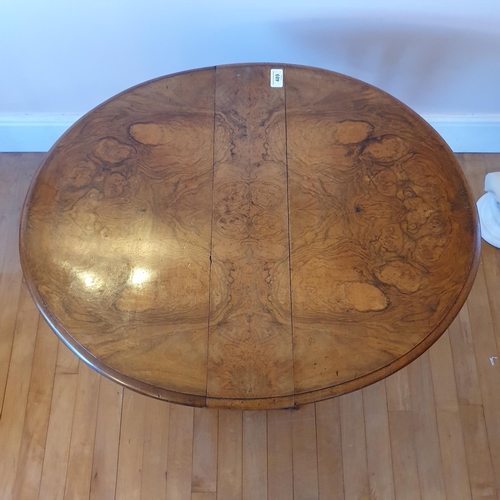 489 - A Victorian burr walnut Sutherland table, on turned supports, 74 cm wide