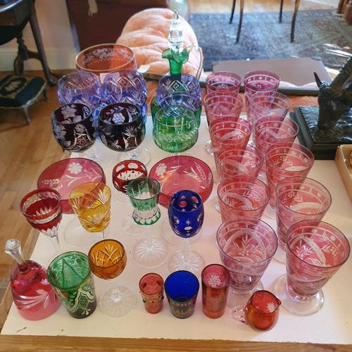 492 - A set of twelve ruby flashed and cut glass tumblers, and other assorted coloured glass (qty)