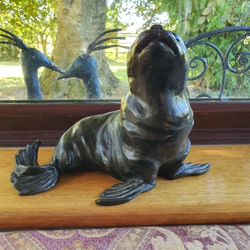 498 - A Rosalie Johnson bronze figure of a sealion, 19 cm high