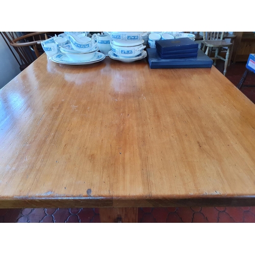 543 - A pine kitchen table, and end supports joined by a stretcher,  167 cm wide x 114 cm deep x 74 cm hig... 