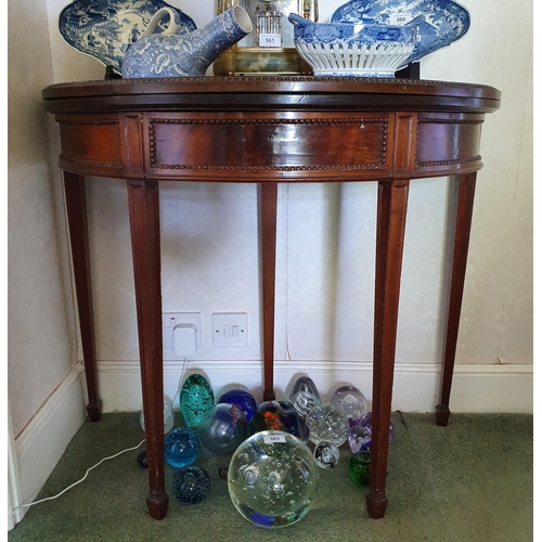 562 - An Edwardian mahogany D shaped card table, on tapering square legs with spade feet, 90 cm wide