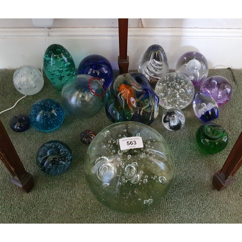 563 - A large glass dump type weight, 60 cm high, and other assorted glass weights (qty)