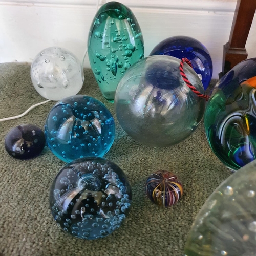 563 - A large glass dump type weight, 60 cm high, and other assorted glass weights (qty)