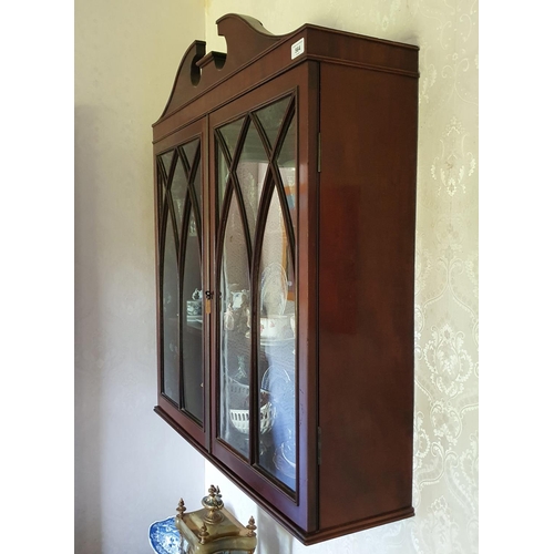 564 - A late 19th century mahogany hanging wall cabinet, having a pair of gothic bar glazed doors, 81 cm w... 