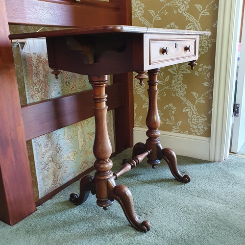 570 - An early Victorian mahogany dropleaf occasional table, with a frieze drawer, of baluster turned legs... 