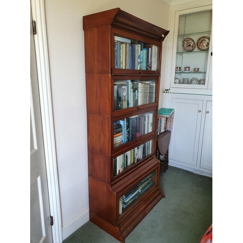 581 - Bedroom Two.
A Globe Wernicke style five section mahogany bookcase, with bevelled glass doors, 86 cm... 