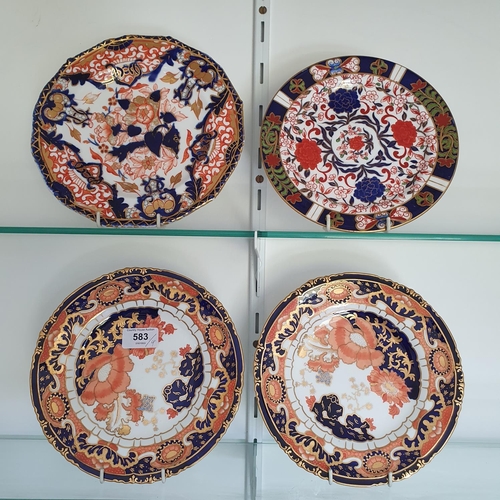 583 - A pair of Royal Crown Derby plates, 22 cm diameter, and two other similar plates (4)