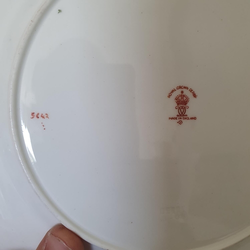 583 - A pair of Royal Crown Derby plates, 22 cm diameter, and two other similar plates (4)