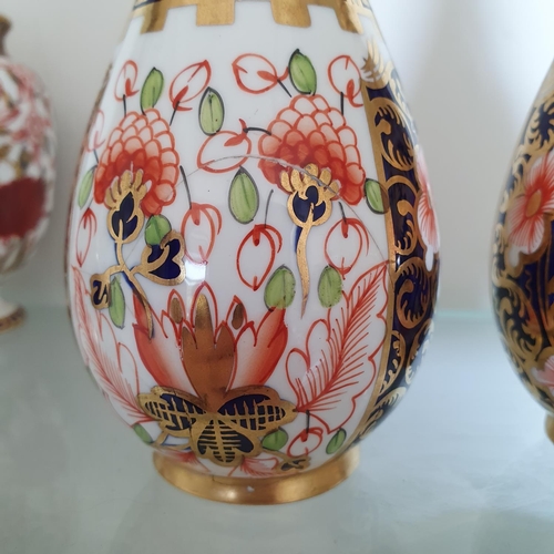 587 - A pair of Royal Crown Derby vases, of ovoid form, 15.5 cm high (2)