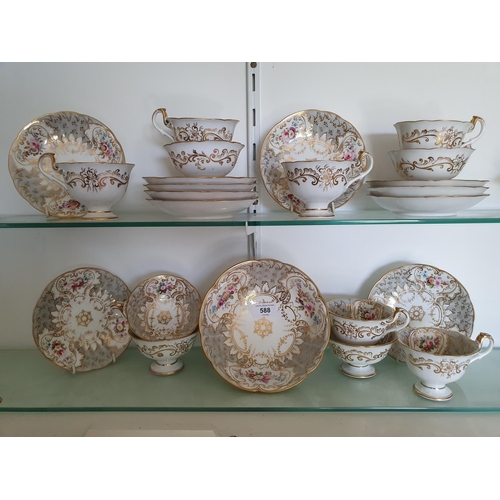 588 - An early Victorian porcelain part tea service, with floral and gilt decoration