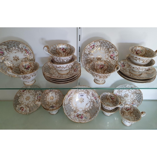 588 - An early Victorian porcelain part tea service, with floral and gilt decoration