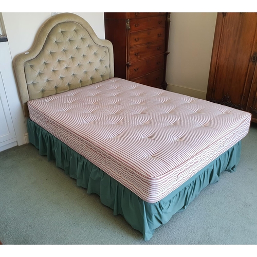 590 - A four foot six inch bed, with a headboard, duvet and related items