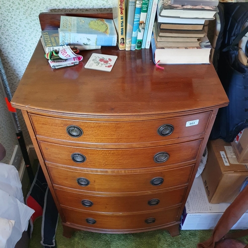 603 - A bow front mahogany chest, of five graduated long drawers, 62 cm wide