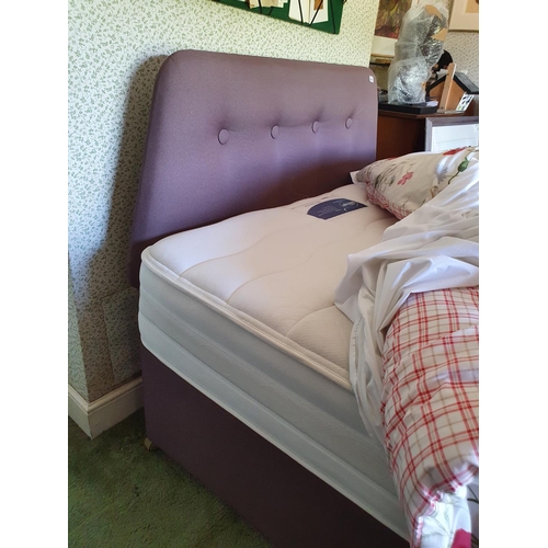 606 - A four foot six inch bed, with headboard and duvet etc.