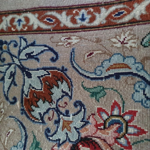 616 - A Persian runner, decorated foliage on a cream ground, 330 x 75 cm