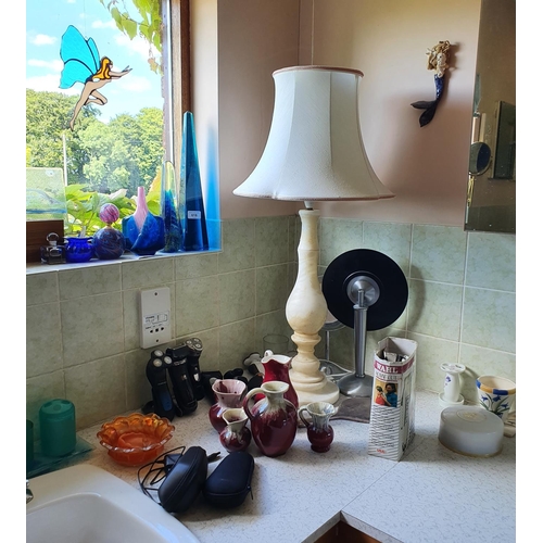 618 - The Second Bathroom.
The contents including assorted glass, a wall mirror in a silvered frame and su... 