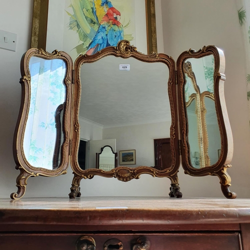 629 - A walnut and parcel gilt three plate dressing mirror, 57 cm high