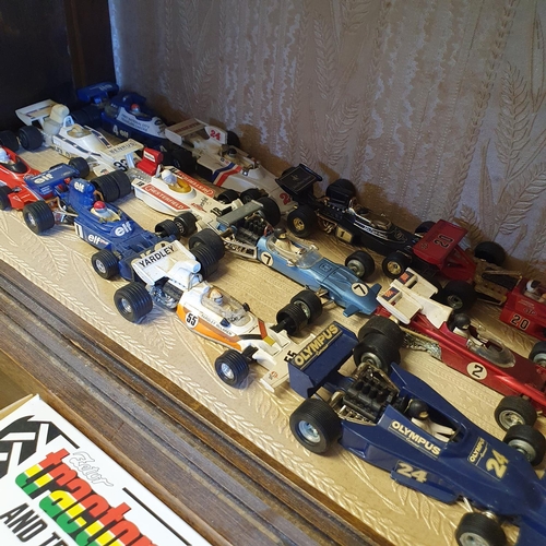 670 - Assorted model buses, racing cars, other cars and motorcycles