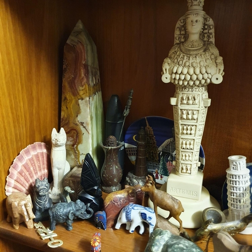 675 - A group of sand art, two obelisks, and other assorted items (second shelf down on the lounge unit)