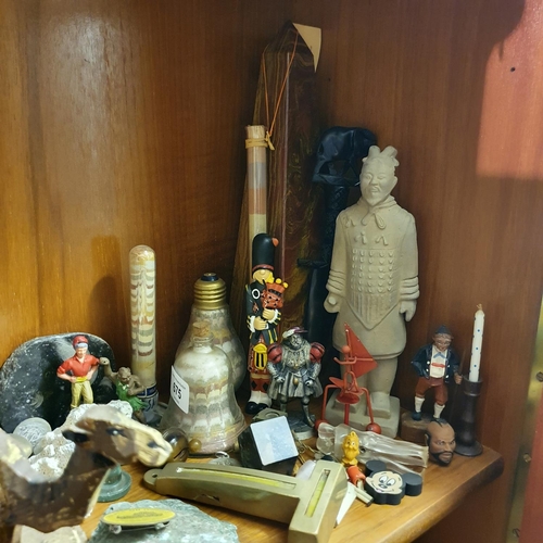 675 - A group of sand art, two obelisks, and other assorted items (second shelf down on the lounge unit)