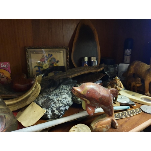 676 - A small geode, various fossils, and other items (third shelf down on the lounge unit)