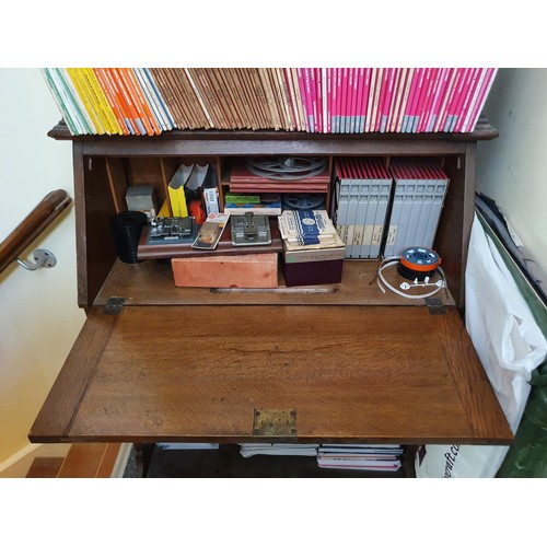 651 - An Edwardian bureau bookcase, having a pair of leaded glass doors above a fall front, 93 cm wide