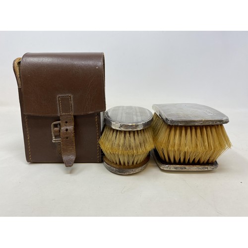 557 - A pair of George V silver backed brushes, another pair, and a bowl (5)