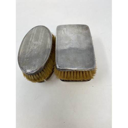 557 - A pair of George V silver backed brushes, another pair, and a bowl (5)
