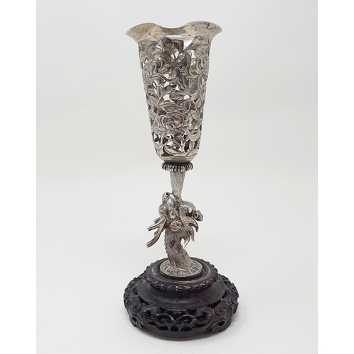 180 - A Chinese silver coloured metal vase, pierced flowers and foliage, on a dragon column, with a carved... 