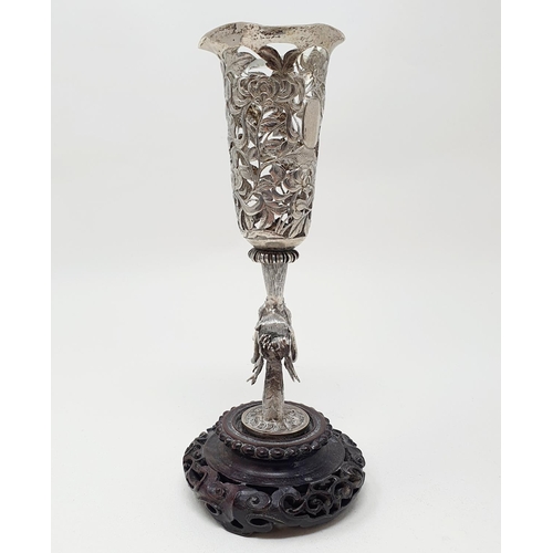 180 - A Chinese silver coloured metal vase, pierced flowers and foliage, on a dragon column, with a carved... 