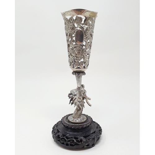 180 - A Chinese silver coloured metal vase, pierced flowers and foliage, on a dragon column, with a carved... 