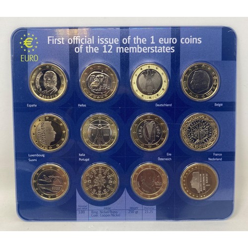 81 - A set of the first official issue of the 1 euro coins, for all twelve member states, mounted on card... 