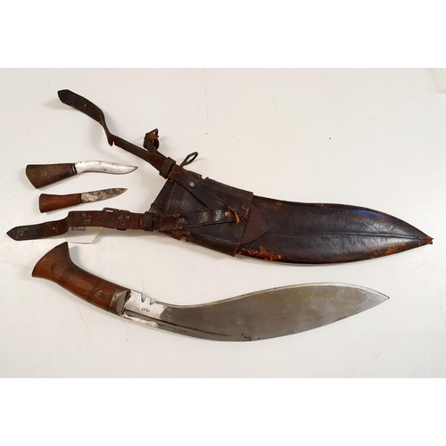 2 - A Kukri, in a leather sheath,  46 cm