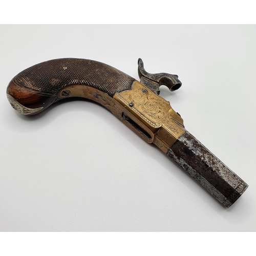 48 - A muff pistol, 15 cm wide, barrel engraved Smith of London, brass and steel with wood grip, proof ma... 