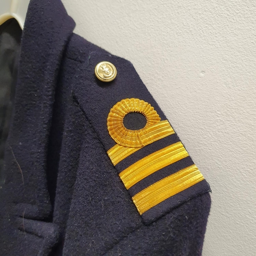 60 - A Royal Naval officers jacket, assorted uniforms