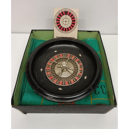 505 - A table top roulette wheel, a cribbage board, and assorted other games and toys (2 boxes)