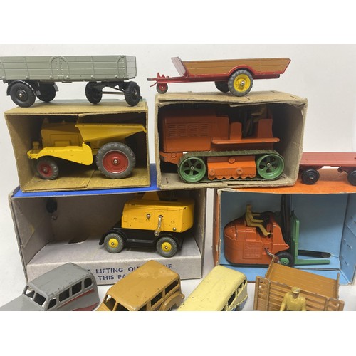 515 - A Dinky Supertoys Heavy Tractor, No. 563, boxed, a Coventry Climax Fork Lift Truck, boxed, a Coles M... 