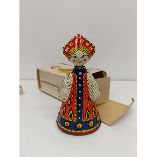 518 - A Russian clockwork doll, boxed, and another (2)