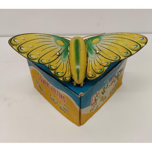 522 - A Chinese tinplate clockwork Somersaulting Butterfly, boxed, and assorted toys (box)