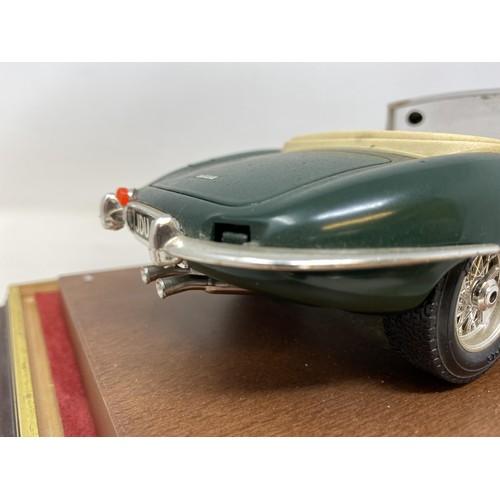 535 - A Burgo model of a Jaguar E Cabriolet (1961), in a mahogany and perspex case, 30 cm wide