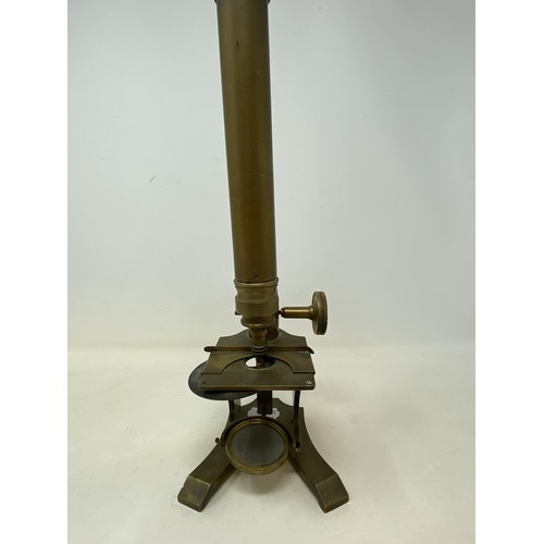 586 - A student's brass microscope, 33 cm high