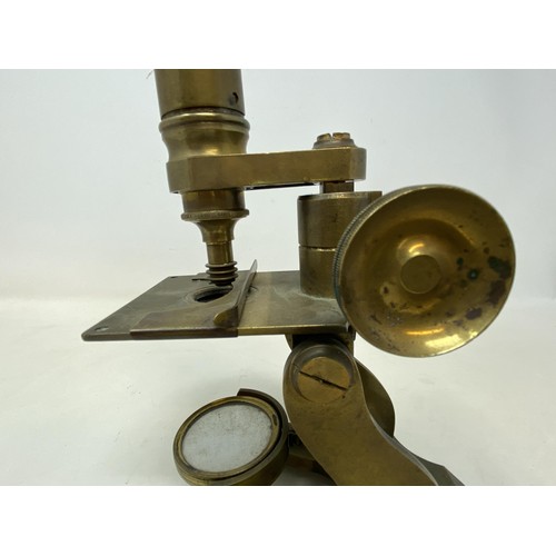 586 - A student's brass microscope, 33 cm high