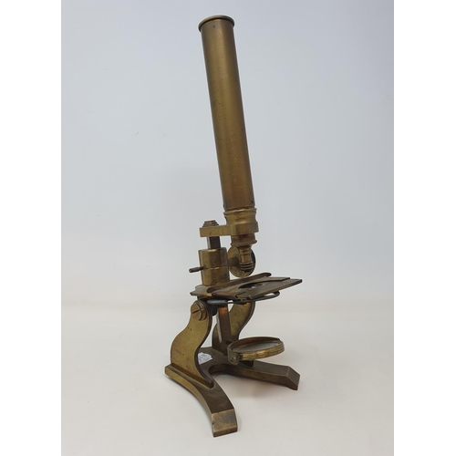 586 - A student's brass microscope, 33 cm high